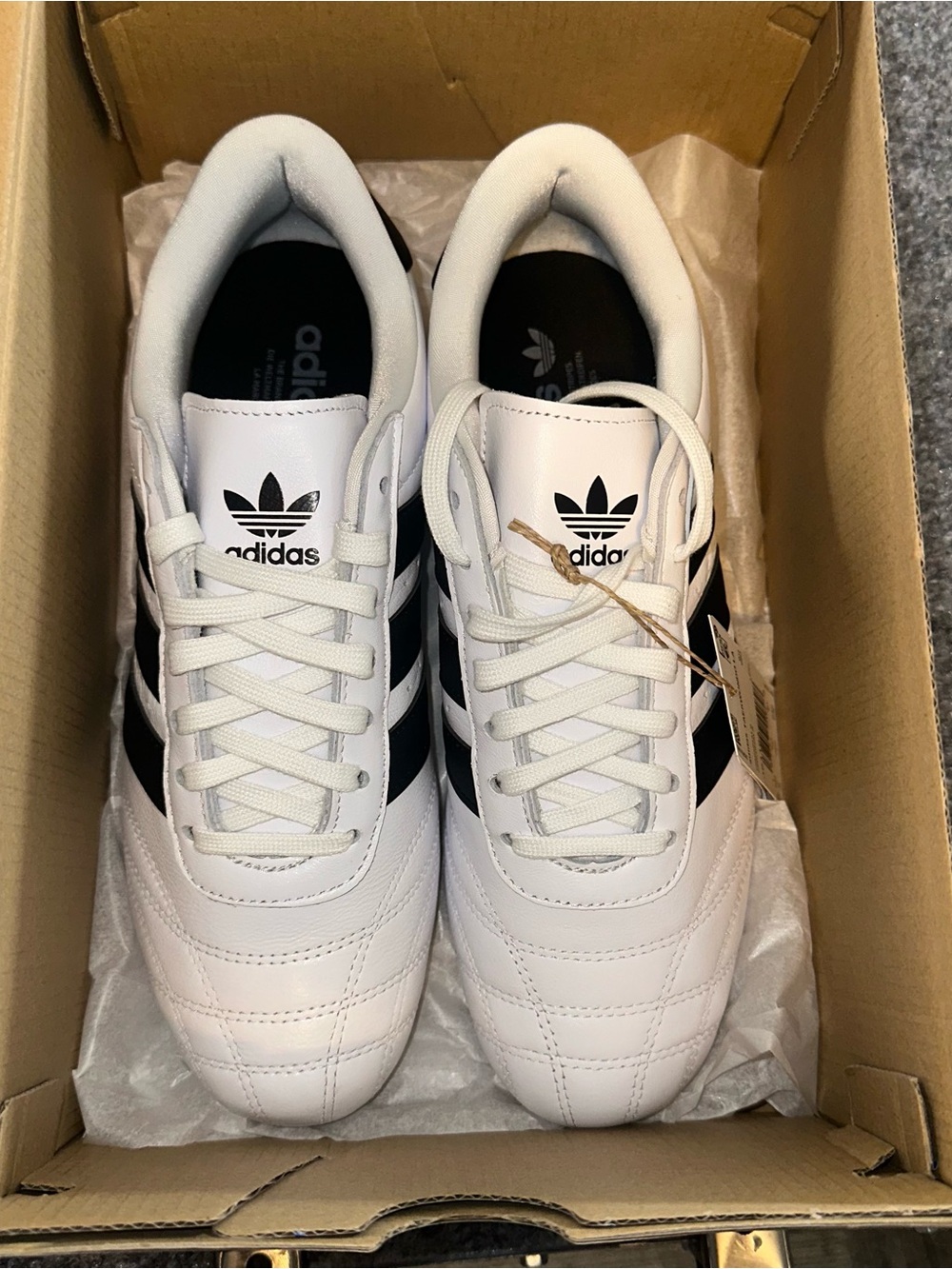 adidas Women’s White Sneakers with Black Three-Stripes